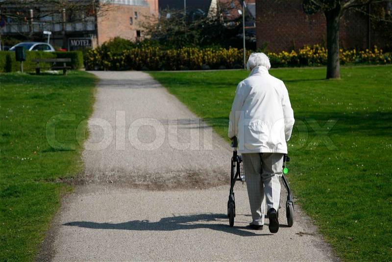 Senior woman with a walking frame, stock photo