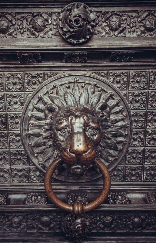 Lion head as a knocker, stock photo
