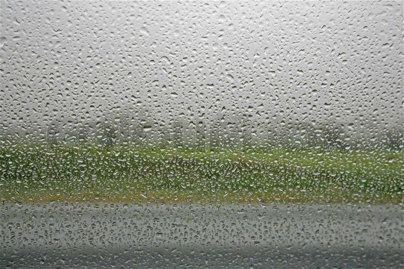 It?s raining outside - seen from inside a car, stock photo