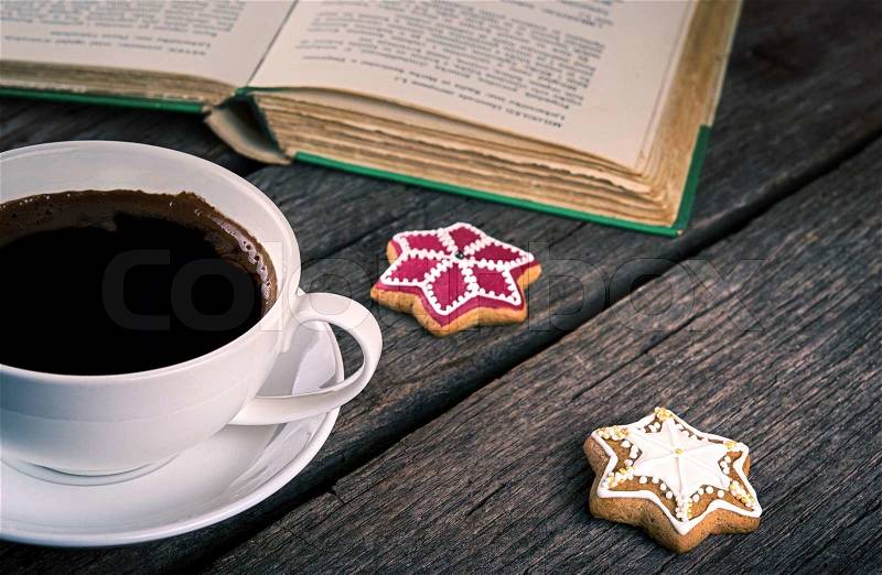 Cup Of Coffee and book on wooden background, stock photo