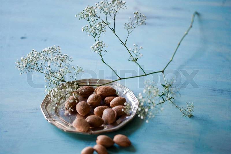 Nuts and sprig of flowers for Christmas decoration, stock photo