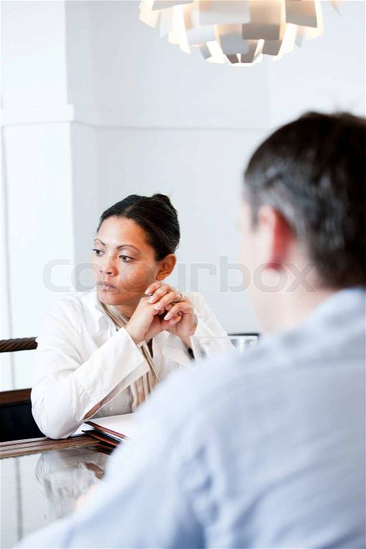 An asian businesswoman during an office meeting, stock photo