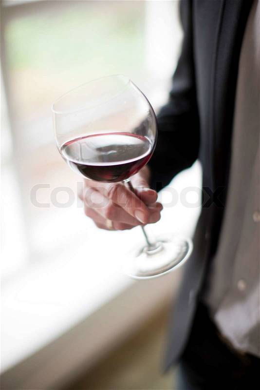 A man tasting red wine, stock photo
