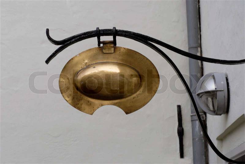 Blank antique brass barber shop sign, stock photo