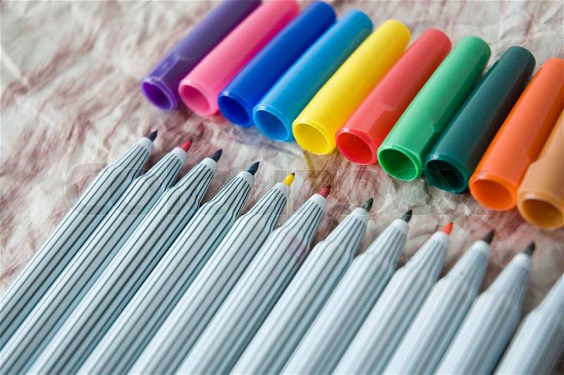 Close up colored pen with cover on background, stock photo