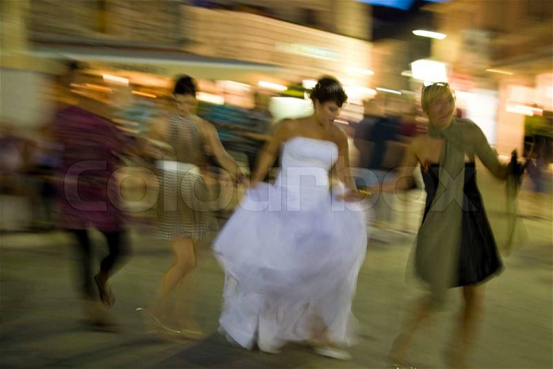 Happy people gathered to Croatian wedding - dancing after the ceremony, stock photo