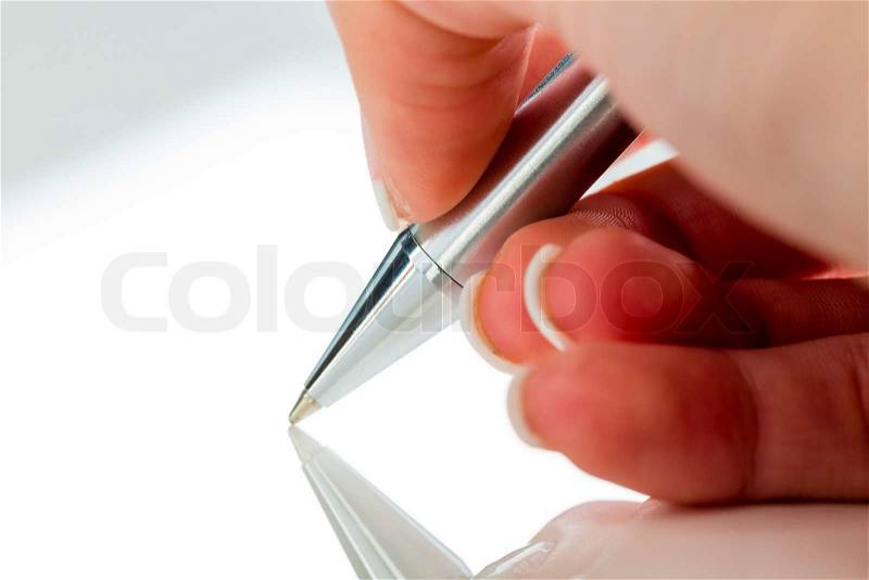 A hand with a fountain pen in the untrerschrift under a contract or testament, stock photo
