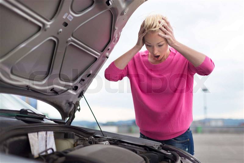 Stressed Young Woman with Car Defect. Engine breakdown, stock photo