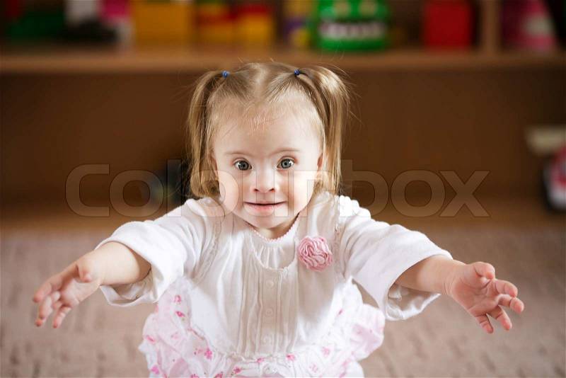 Emotions Down syndrome girl, stock photo