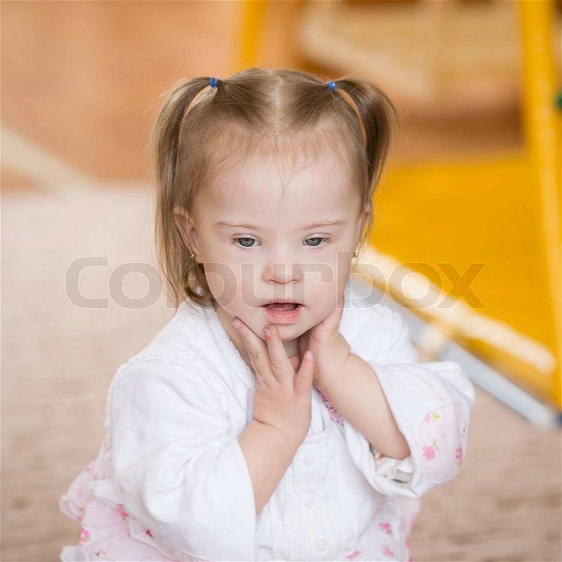 Sweet girl with Down syndrome, stock photo