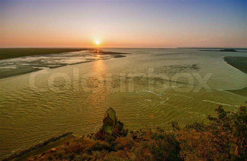 High tide approaching Mont Saint Michel in Normandy - France, stock photo
