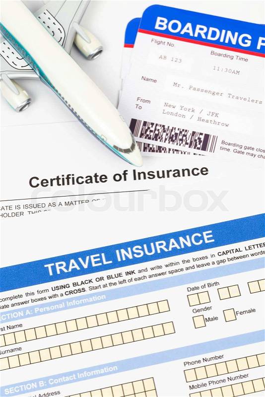 Travel insurance application form with plane model and boarding pass concept for travel planning, stock photo