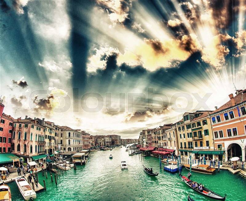 Grand Canal with Venice cityscape and tourists. All recognizable faces blurred, stock photo
