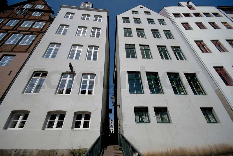 Vintage houses in Deichstrasse in Hamburg, Germany. Narrow passage from backside of buildings, stock photo