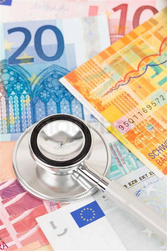 Stethoscope on Europe banknote concept financial health check, stock photo