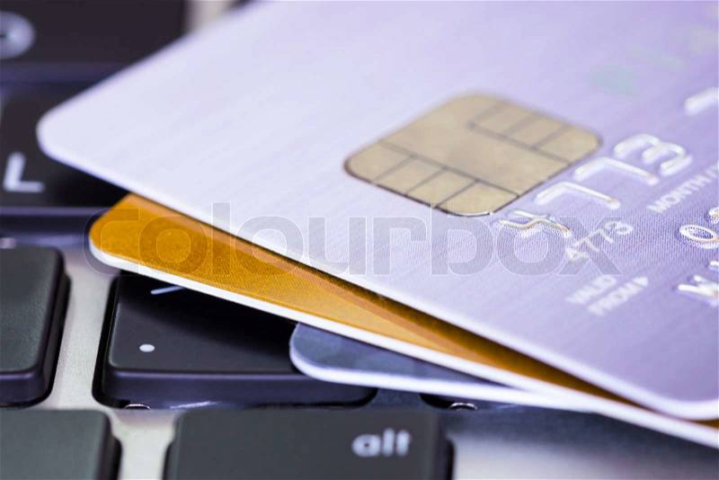 Credit cards on key board, e-commerce concept, stock photo