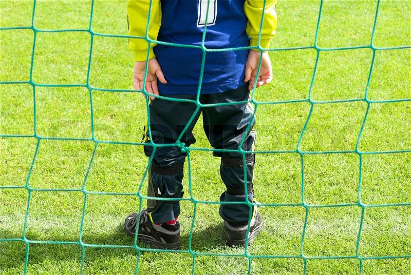 Just on the line. Young football goalkeeper with number one just on the goal line, stock photo