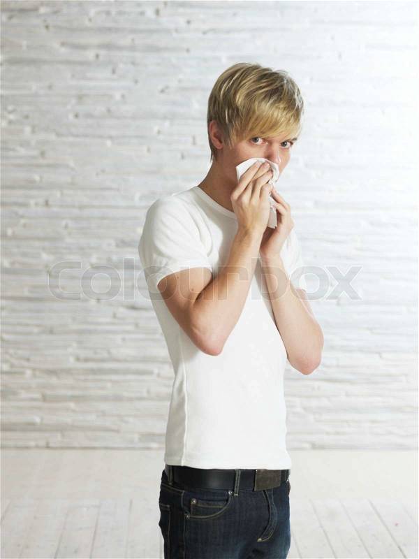 Portrait - caucasian teenage boy with common colds, stock photo