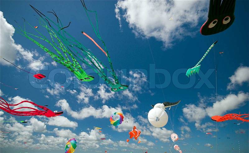 Fun in the Air. Fantasy Kites High-Up in the Blue Sky a Sunny Day on the Beach. Kite Flying Festival on Fanoe, Denmark, stock photo