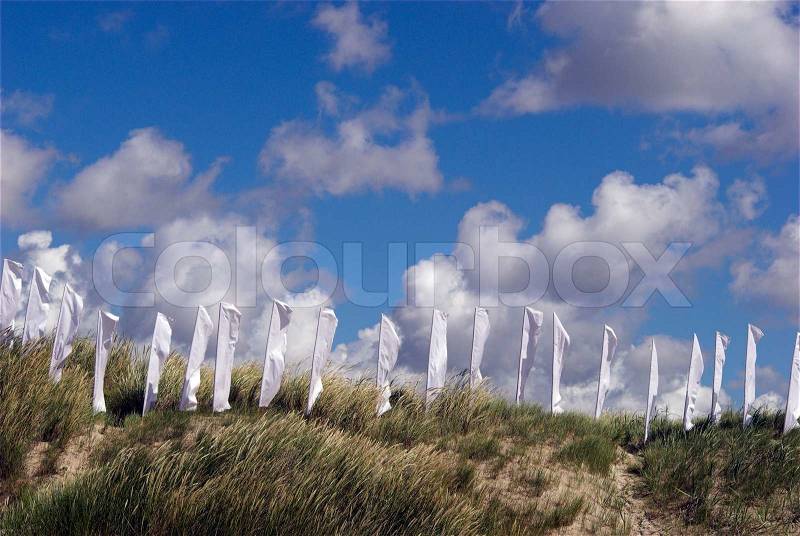 White Flags. White Flags on the ground a Sunny Day on the Beach. Kite Flying Festival on Fanoe, Denmark, stock photo