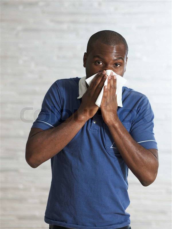 Portrait - african man who has common colds, stock photo