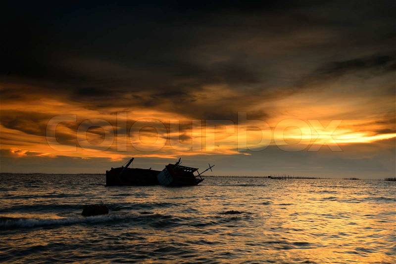 Fishing boat capsized in Thailand, stock photo