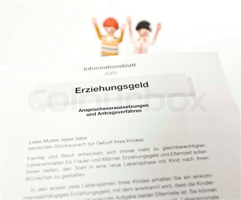 German document on education expenses with miniature toys, stock photo