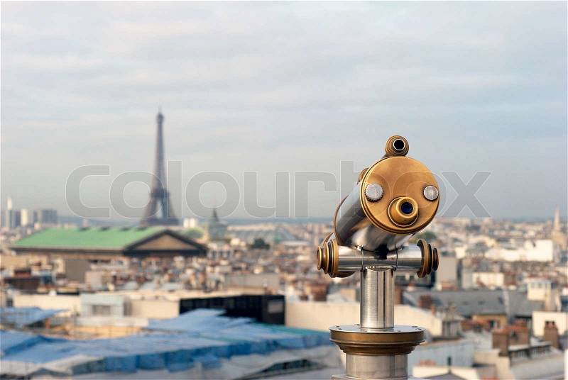 Paris View. Coin-Operated binoculars high up over Paris in France. View from Gallery de La Fayette, stock photo
