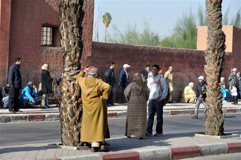 People waiting for the bus in Marrakesh, Morocco. Photo taken at 22th of November 2008, stock photo
