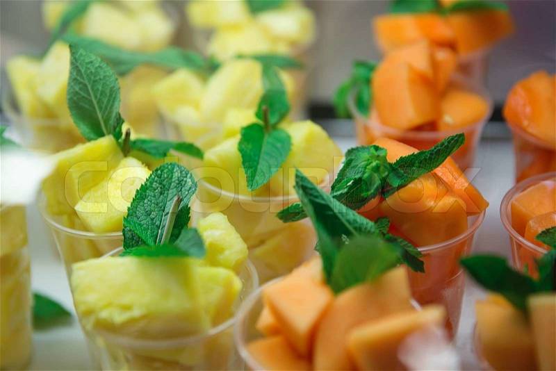 Refreshing fresh pineapples and watermelon pieces with mint leaves , stock photo