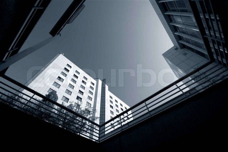 White building from below, sky blue and copy space, stock photo