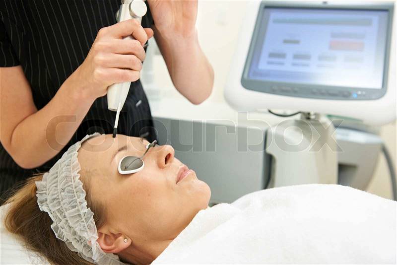 Beautician Carrying Out Q Switch Laser Treatment, stock photo