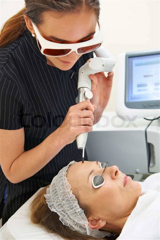 Beautician Carrying Out Q Switch Laser Treatment, stock photo