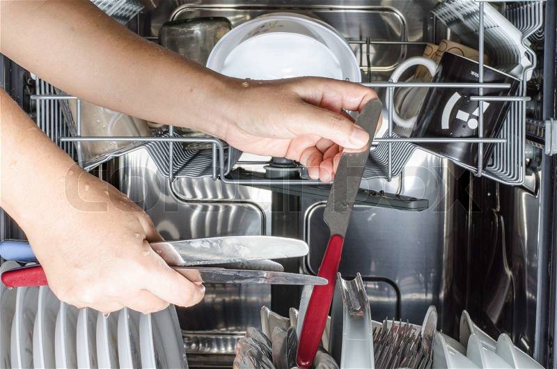 Image of dihes in dishwasher, stock photo