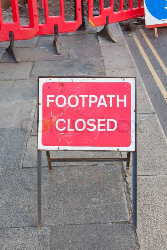 Footpath closed by road maintenance barrier sign, stock photo