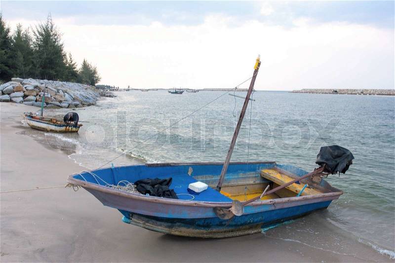 Small fishing wooden boats in the sea, stock photo