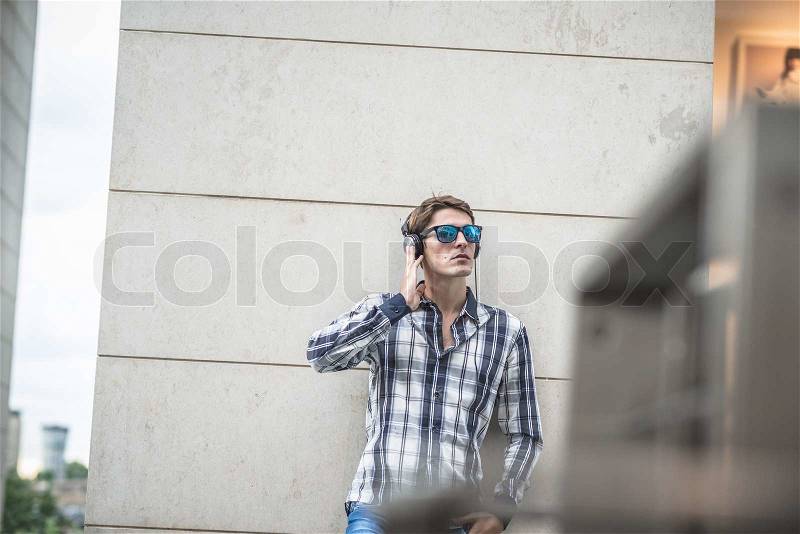 Young model hansome blonde man in the city, stock photo