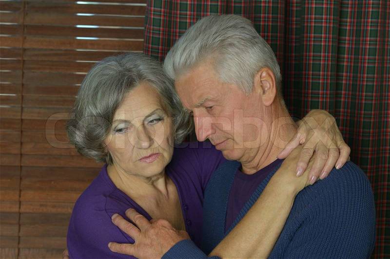 Portrait of sad elderly couple in love, stock photo
