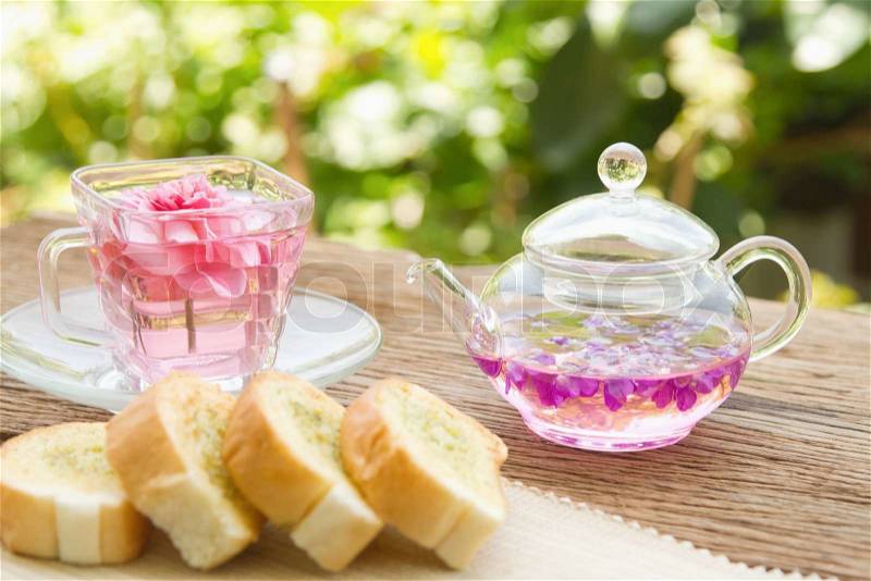 tea setting and homemade garlic bread and in the garden,afternoon tea break, stock photo