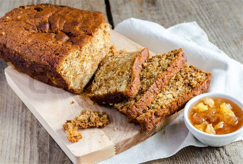 Loaf of banana bread with apple confiture, stock photo