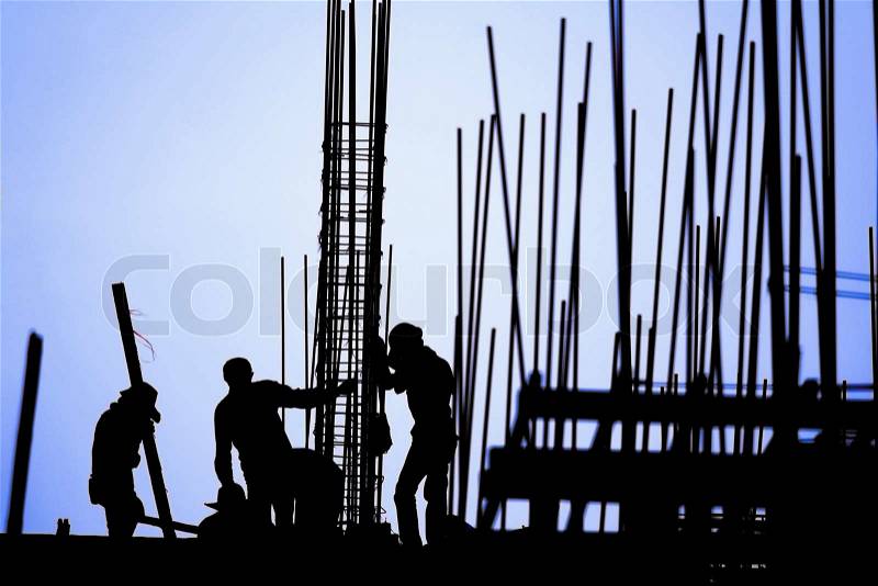 Construction worker silhouette on the work place, stock photo