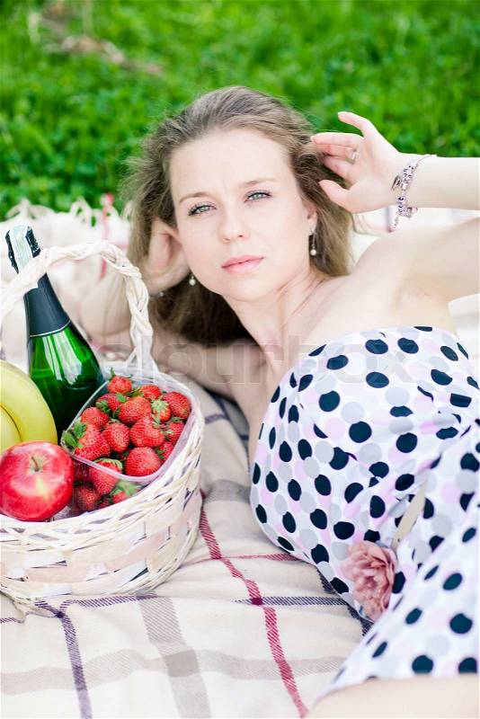 Beautiful woman on the picnic with basket, stock photo