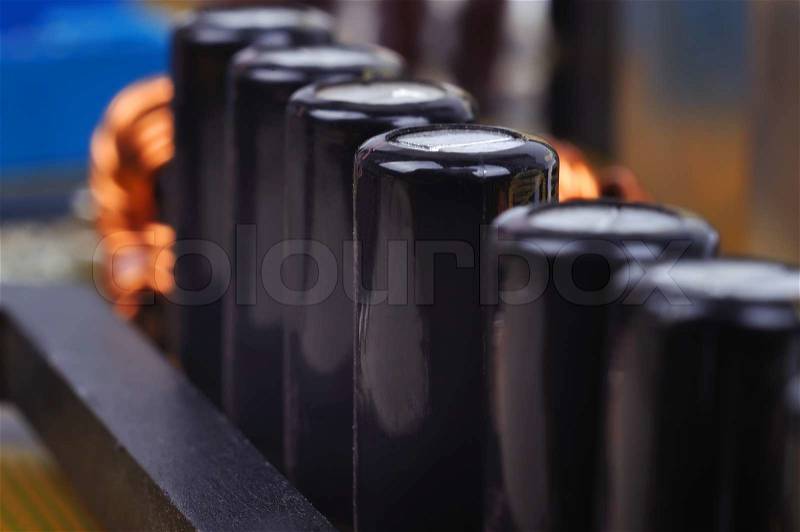 Macro of black capacitors from circuit board, stock photo