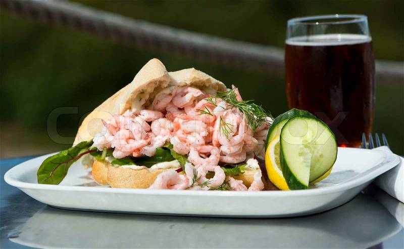 Shrimp Sandwich on the terrace with a nice cold beer, stock photo