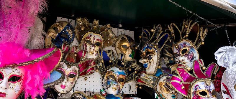 Various venetian masks on sale . colorful artistic masks on the Carnival of Venice, stock photo