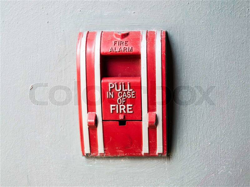 Fire alarm control panel on grey wall, stock photo