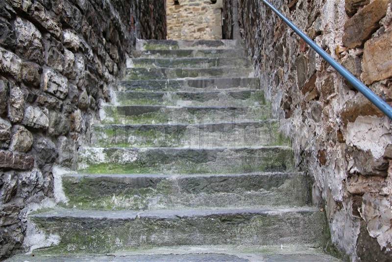 Old damaged stone staircase, up and down, textured background, stock photo