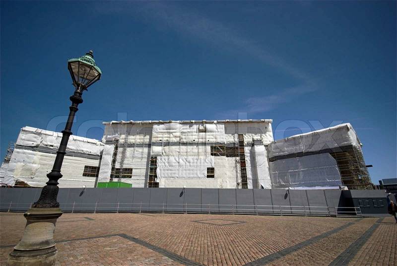 Building Site and wrapping plastic - Amalienborg, Famous Royal Residence in Copenhagen, Denmark being rebuilt, stock photo