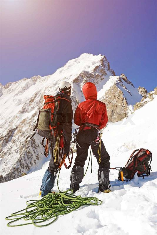 A two climber reaching the summit, stock photo