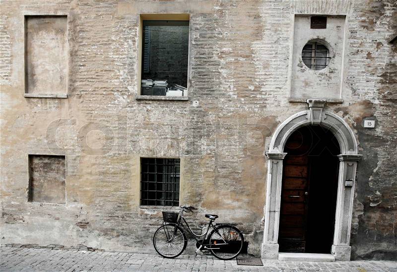 Old Italian facade with new bike - Senigallia, Umbria - Italy, stock photo